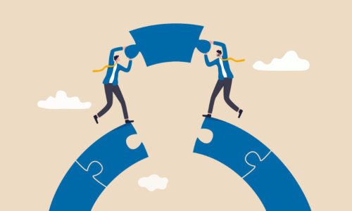 Business teamwork and partnership help to achieve team success, think together to solve business problem, business connection concept, businessmen working team building connect jigsaw puzzle bridge.